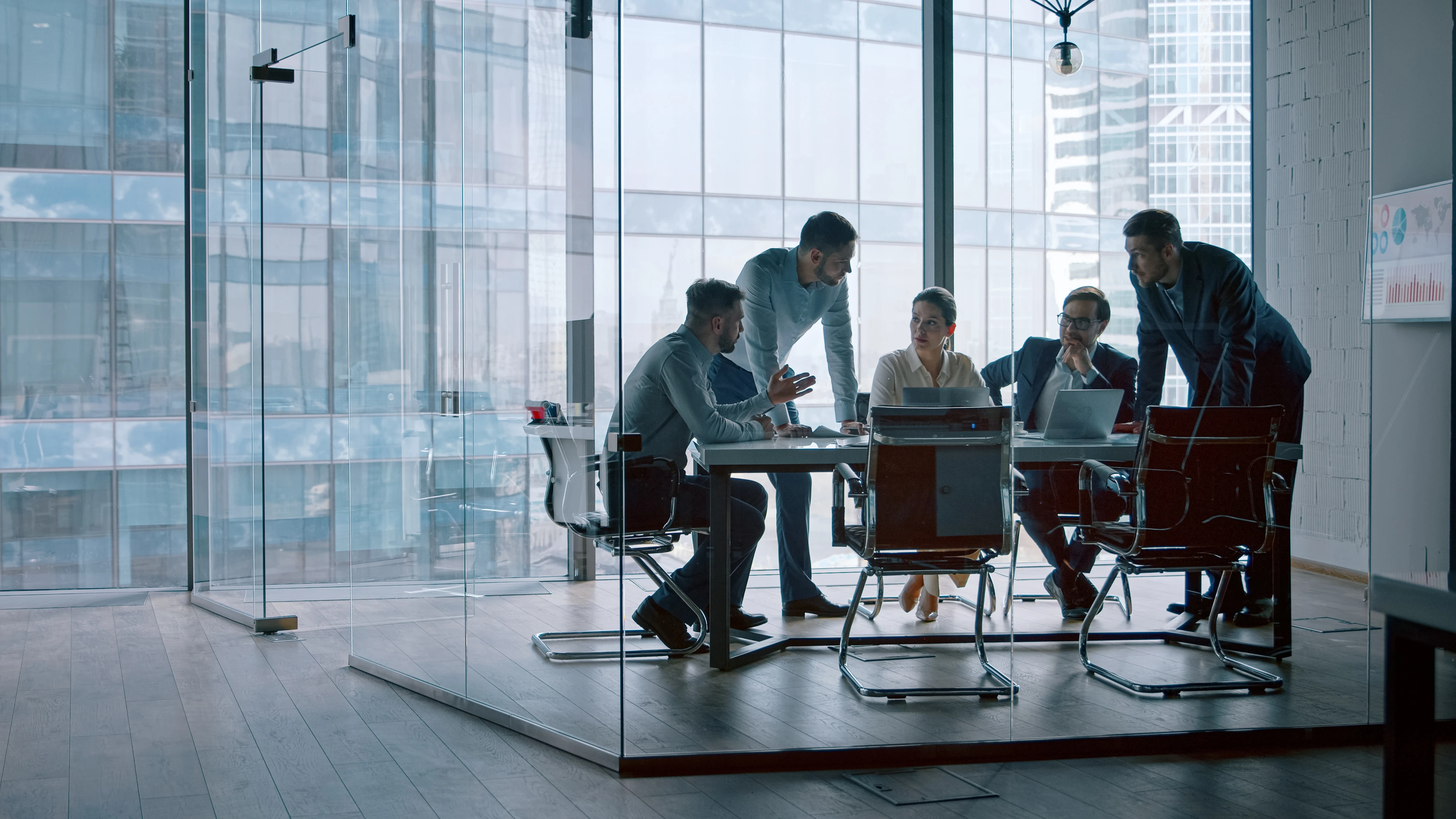 Room of people sitting at finance meeting